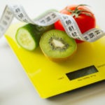 diet-fruits-vegetables-with-measuring-tape-weight-scale_118454-3598