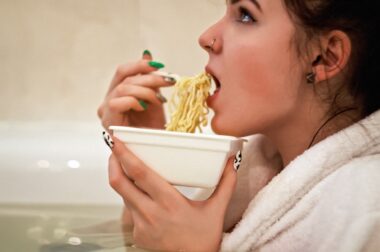 A girl eating instant noodles